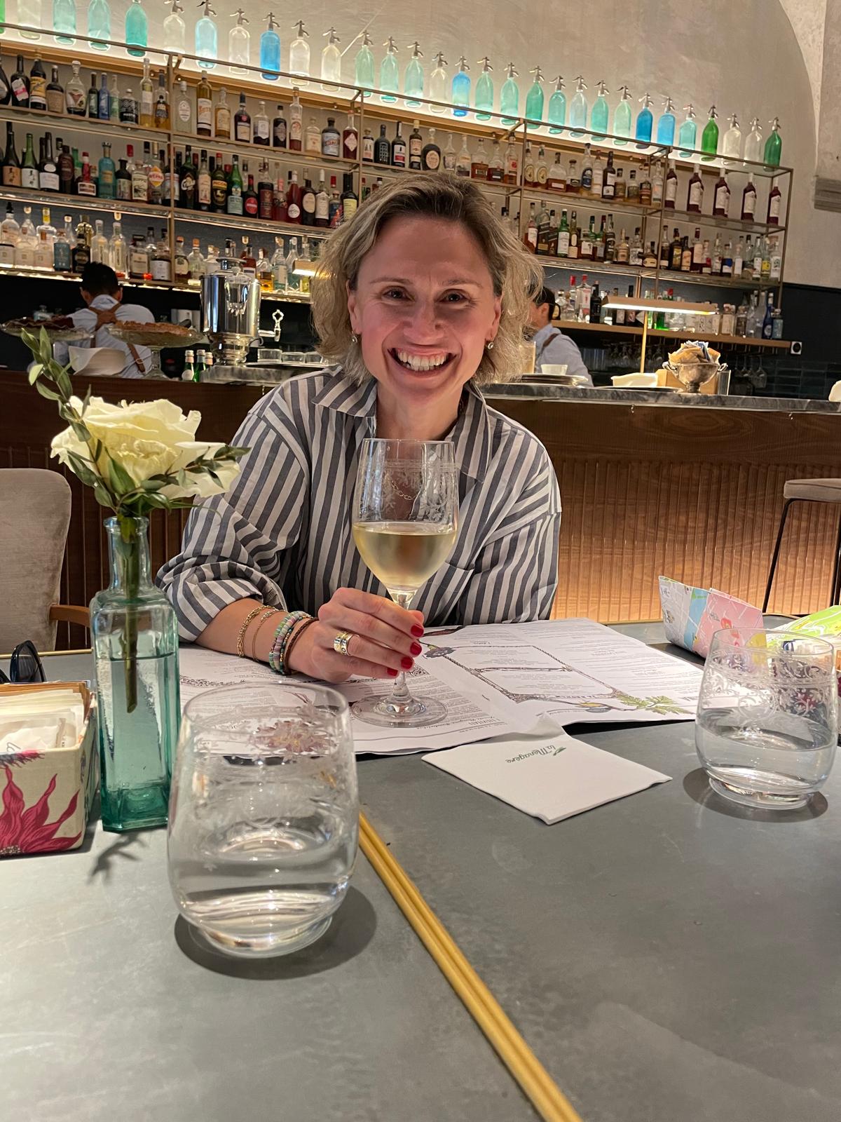 Nataliya Kolydchak smiling at a bar
